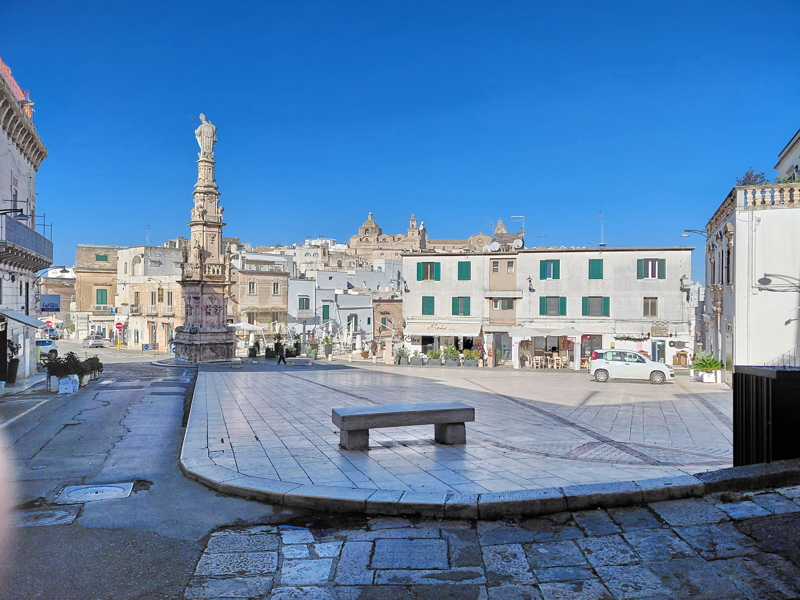 View of Piazza della Libertà in Ostuni, featuring the Colonna di Sant'Oronzo 